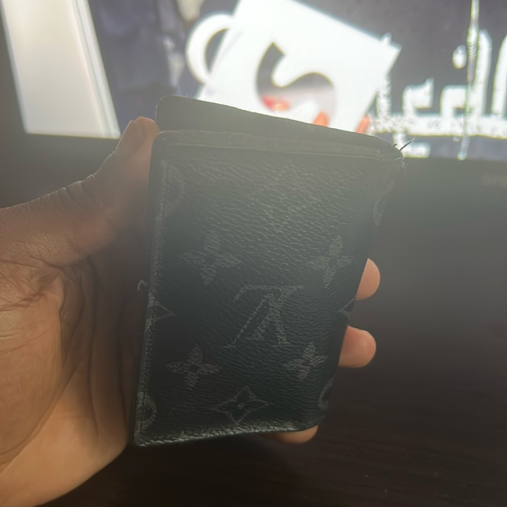 Black Louis Vuitton wallet made in Spain.